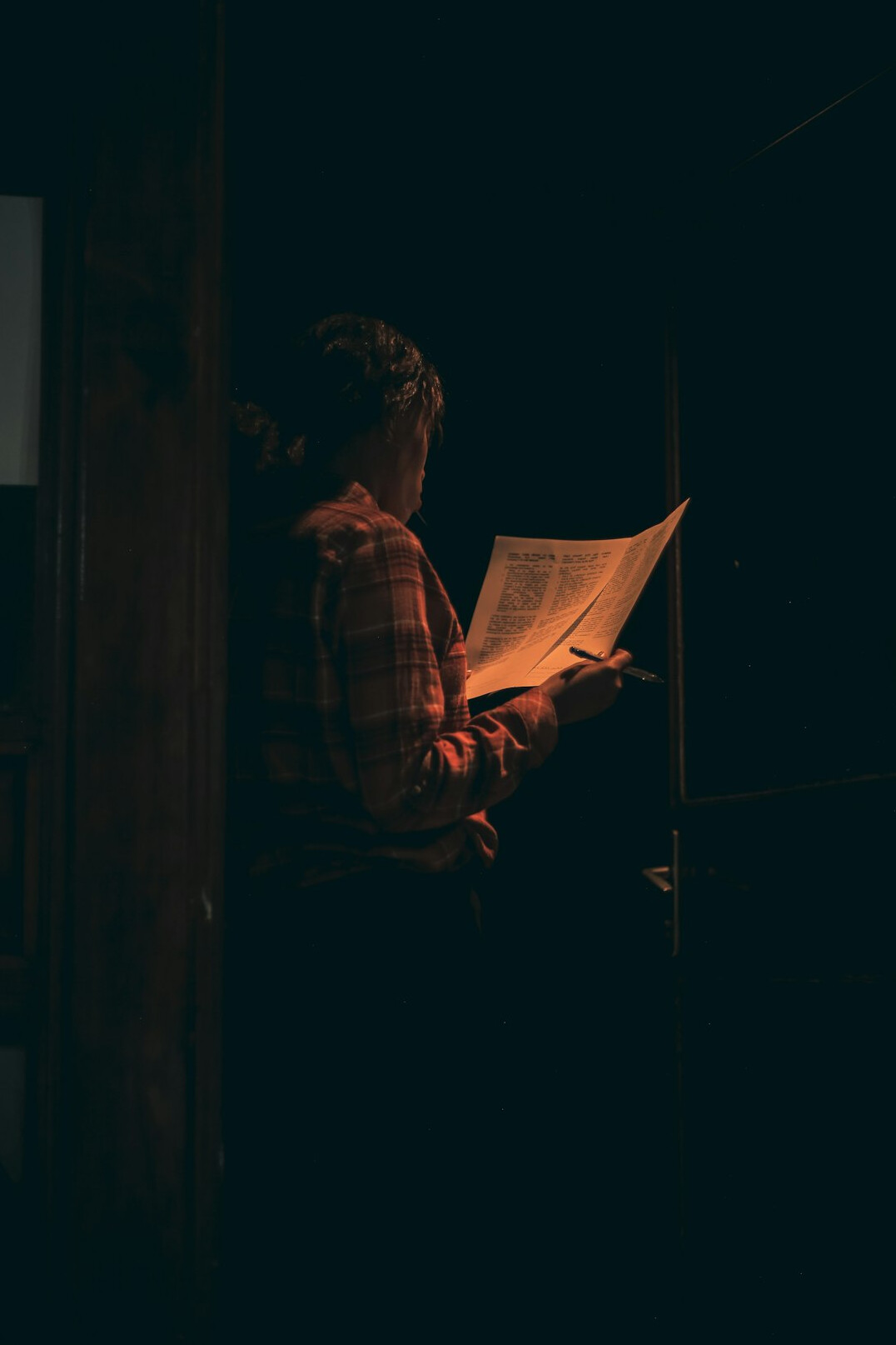 person reading in dim light